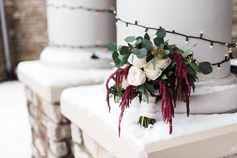 Brides bouquet surrounded by snow