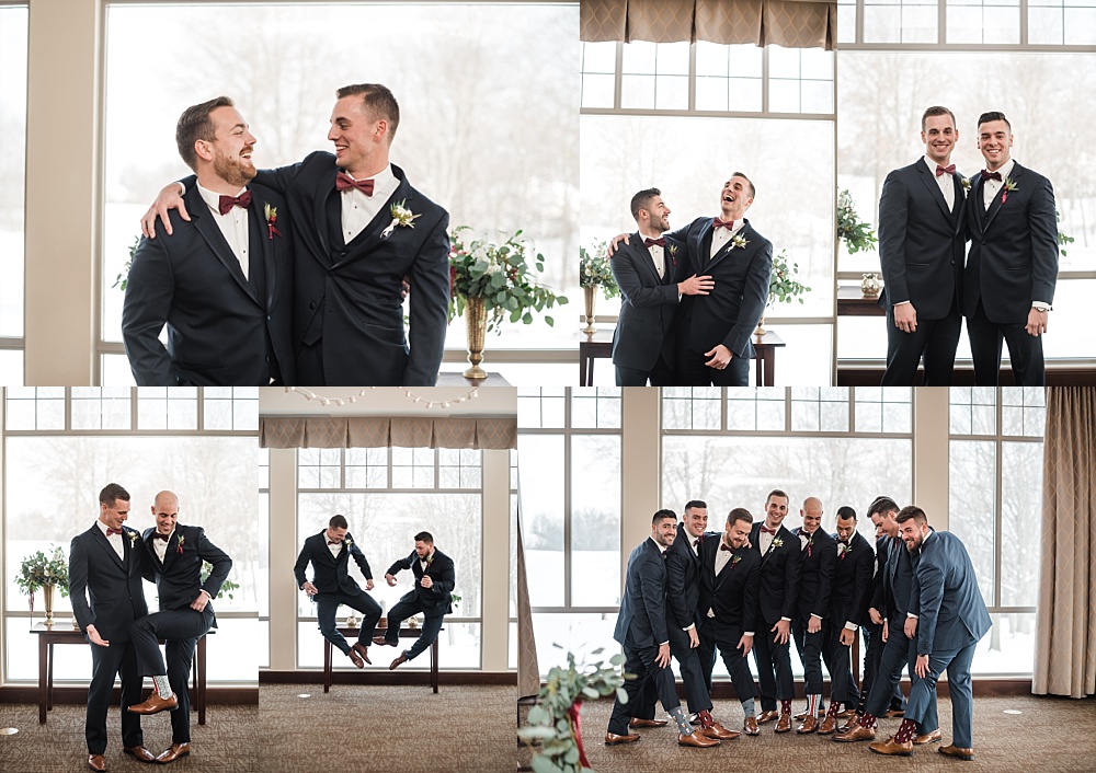 Groom and groomsmen laugh and pose in front of windows at Scioto Reserve Country Club