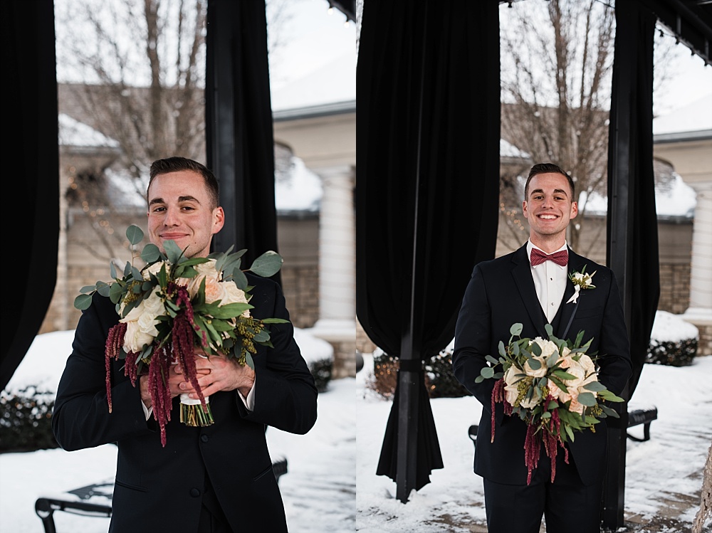 Groom poses for portraits in the snow at Scioto Reserve Country club during their winter wedding