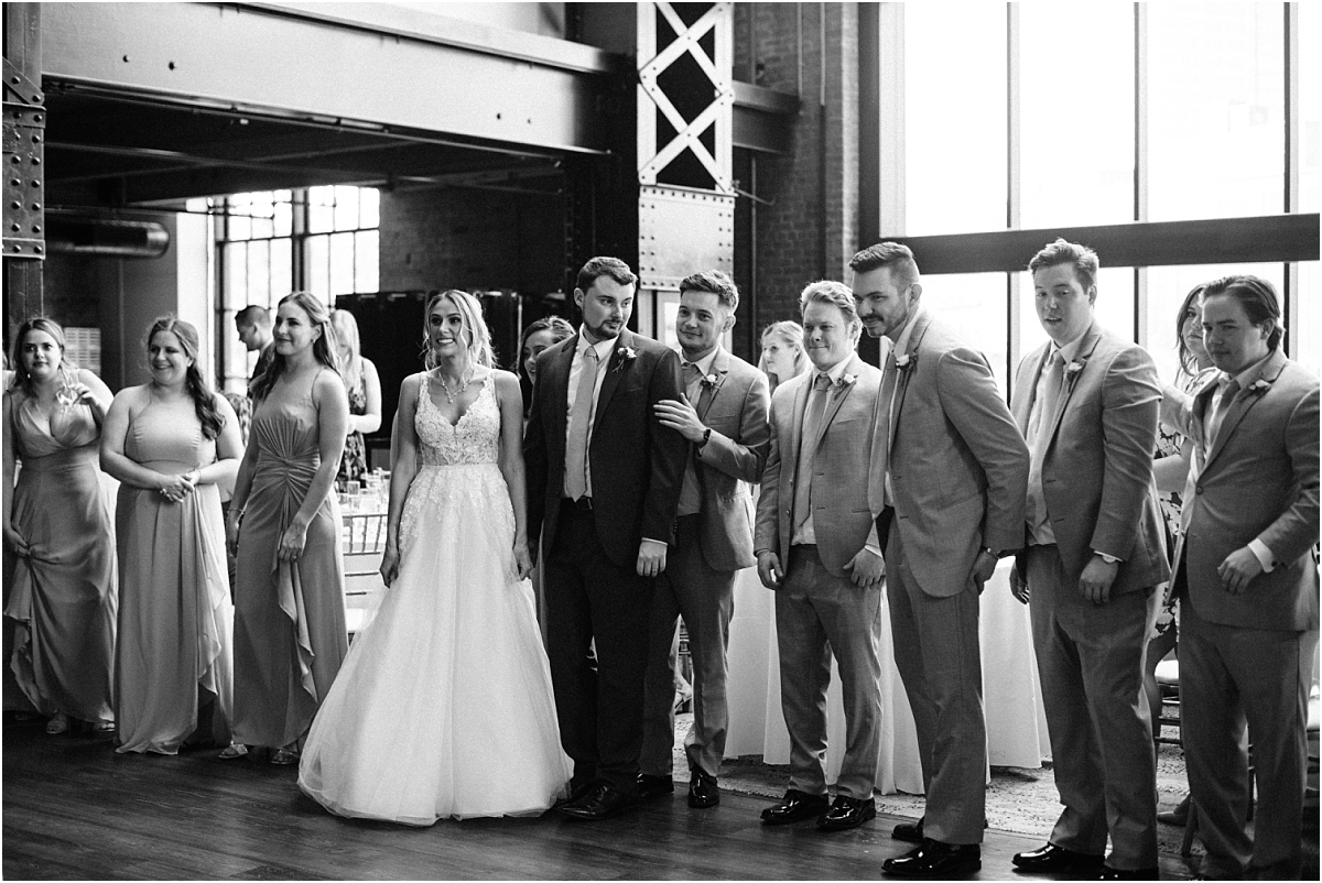 bridal party being greeted
