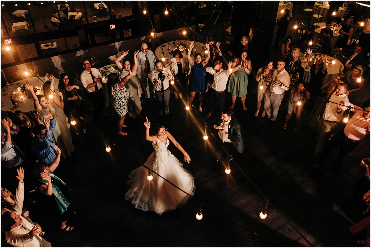 bride spins around the dance floor during her wedding reception