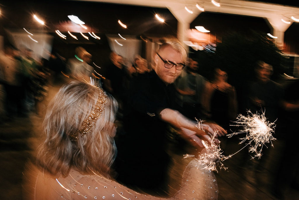 bride and groom dance with sparklers