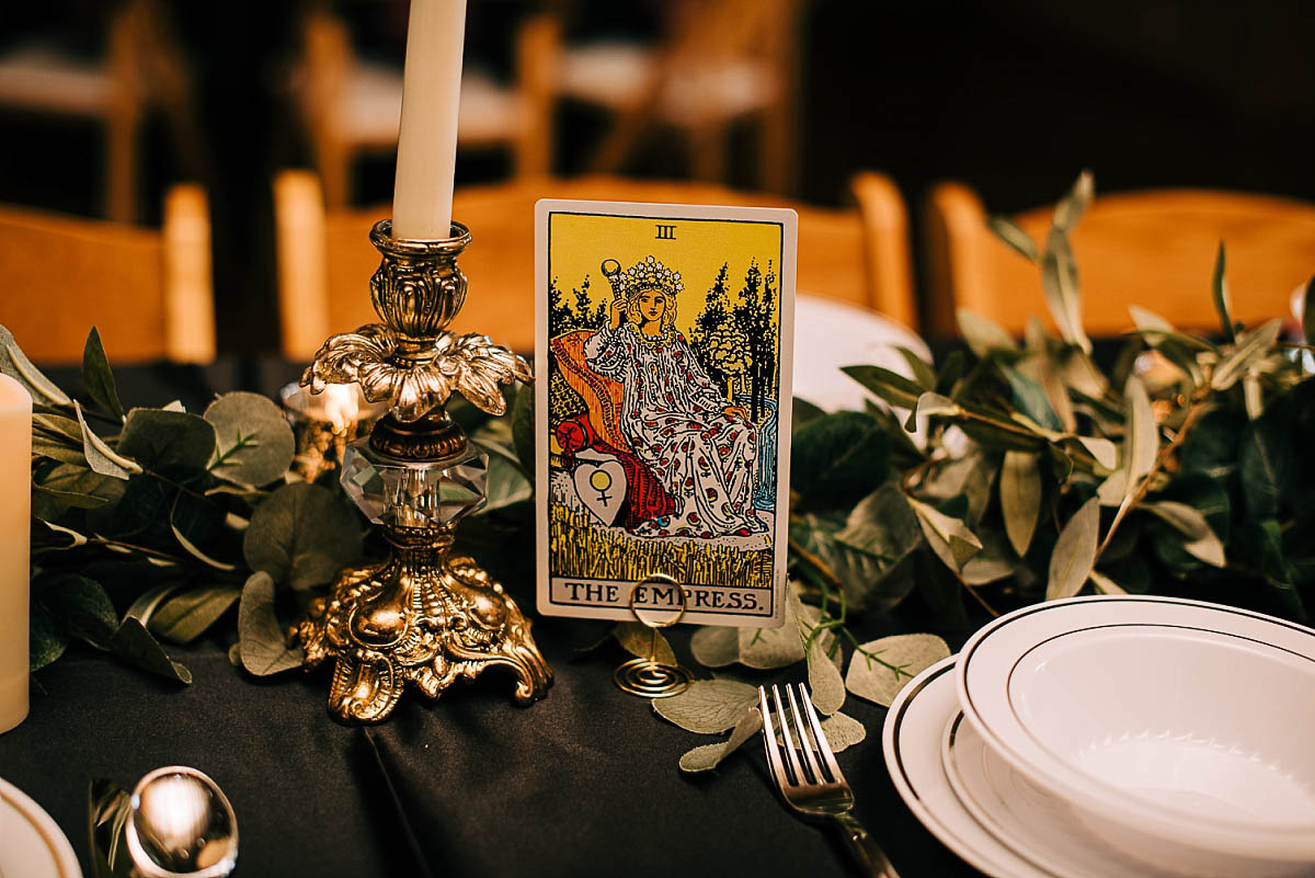 A tarot card being used as table indicator