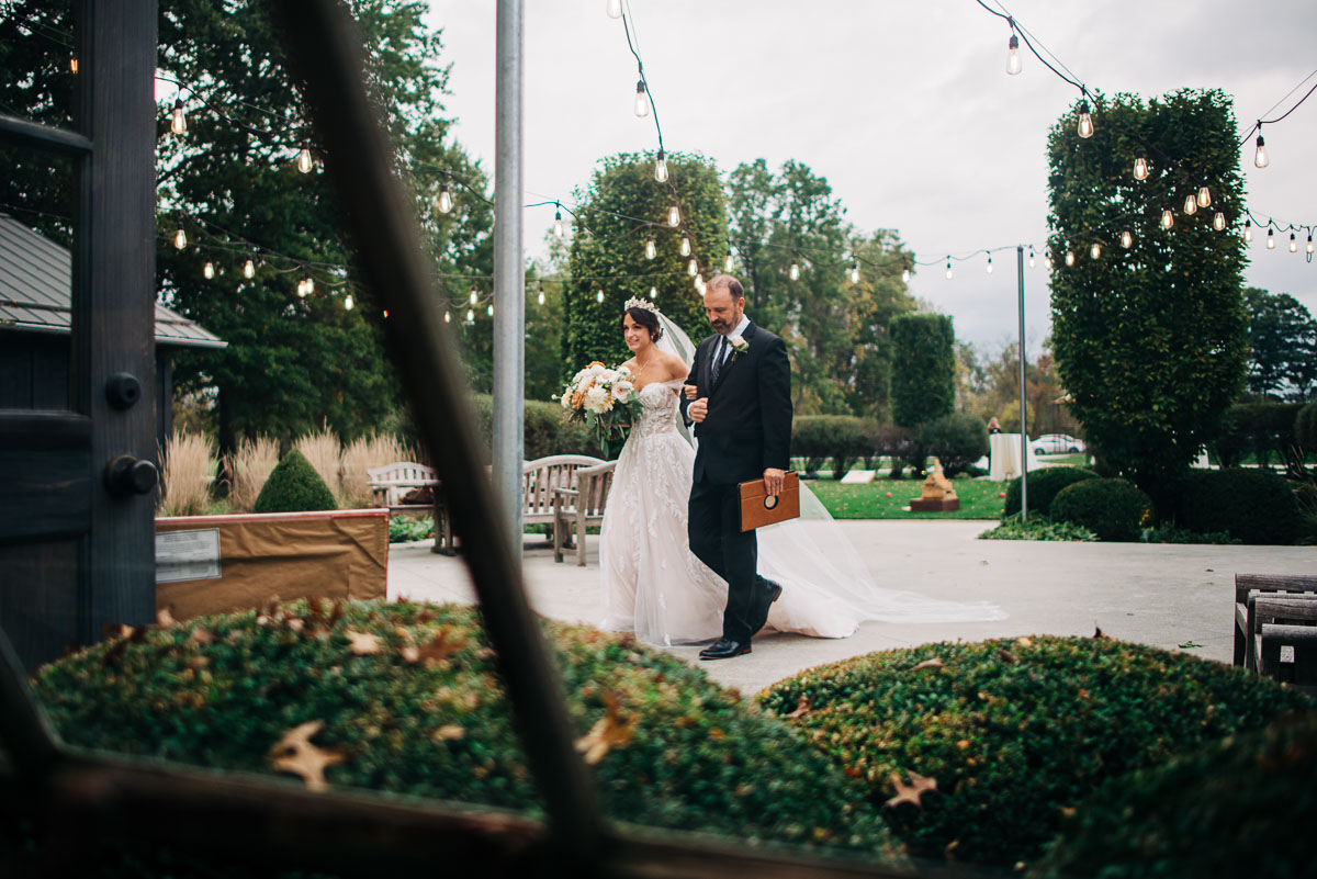 Father walks his bride to the greenhouse at Oak Grove