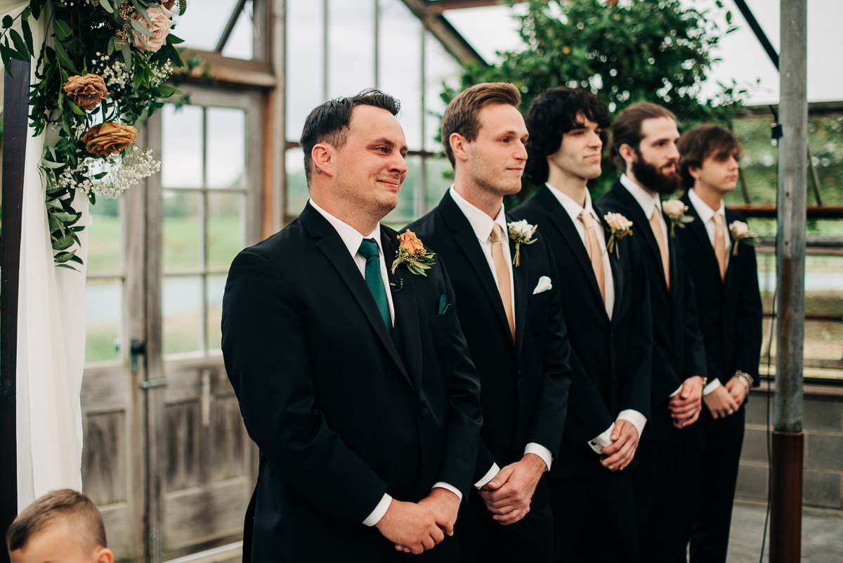 Groom cries when he sees his bride for the first time while she enters the greenhouse at Oak Grove