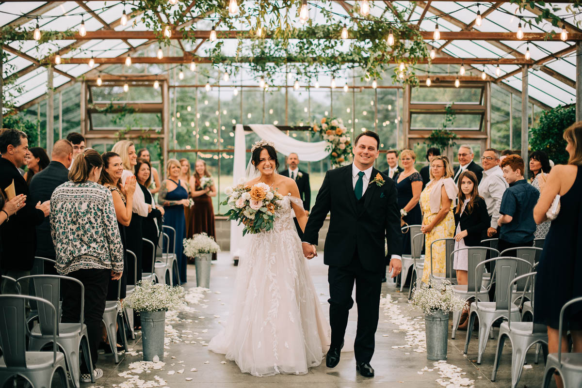 Bride and groom are walk down the aisle as husband and wife