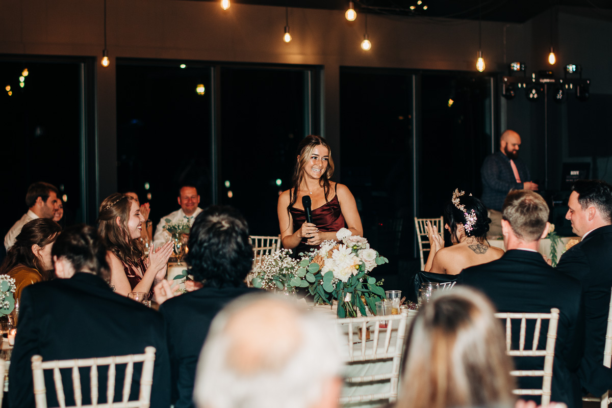 Bridesmaid gives a toast during the wedding reception at Oak Grove
