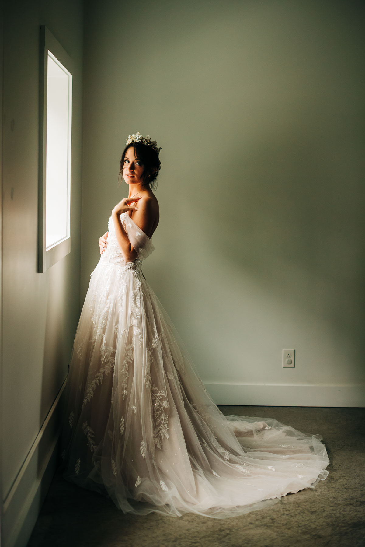 Bride poses in dramatic lighting at Oak Grove