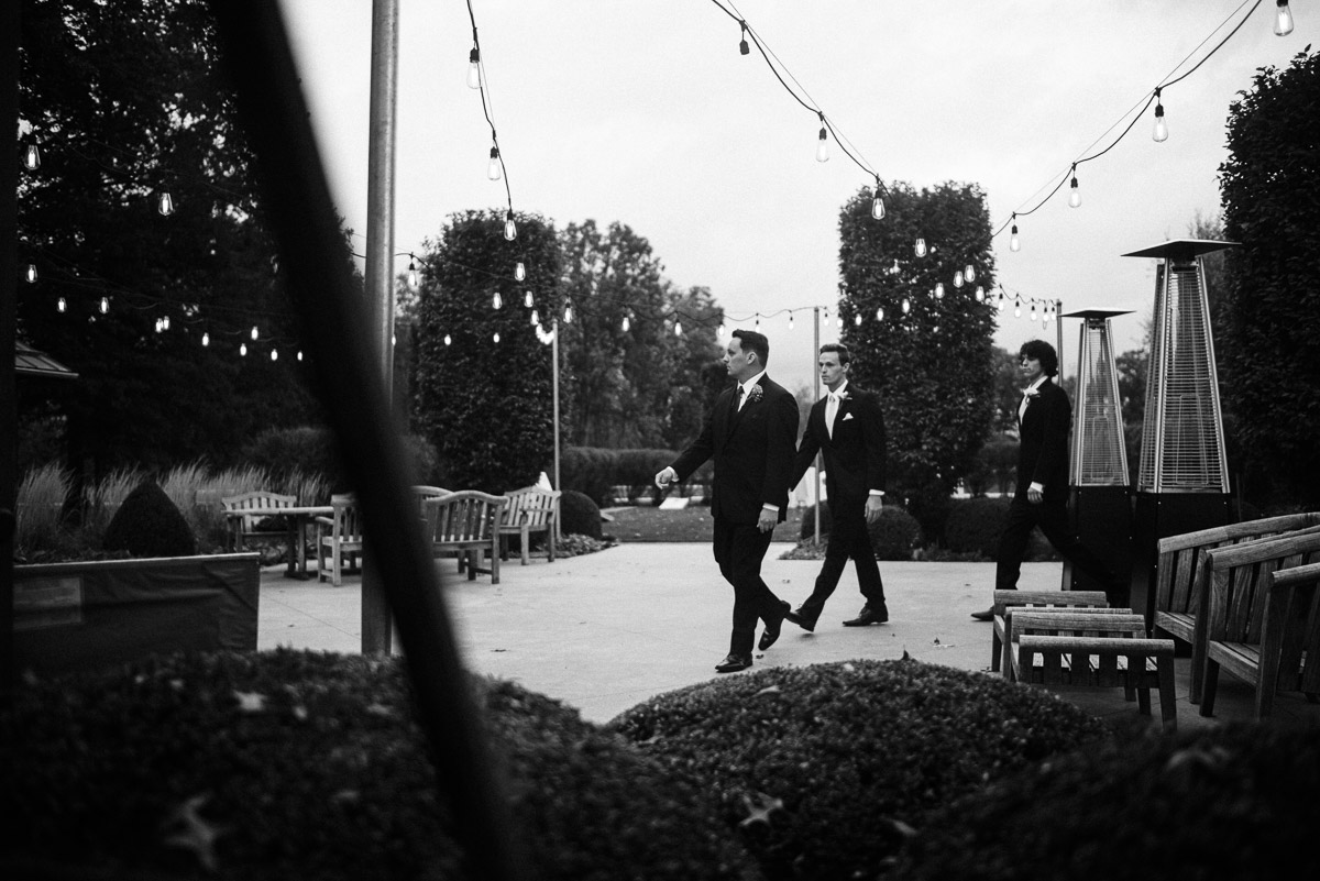 Groom makes his way to the ceremony space in the greenhouse at Oak Grove