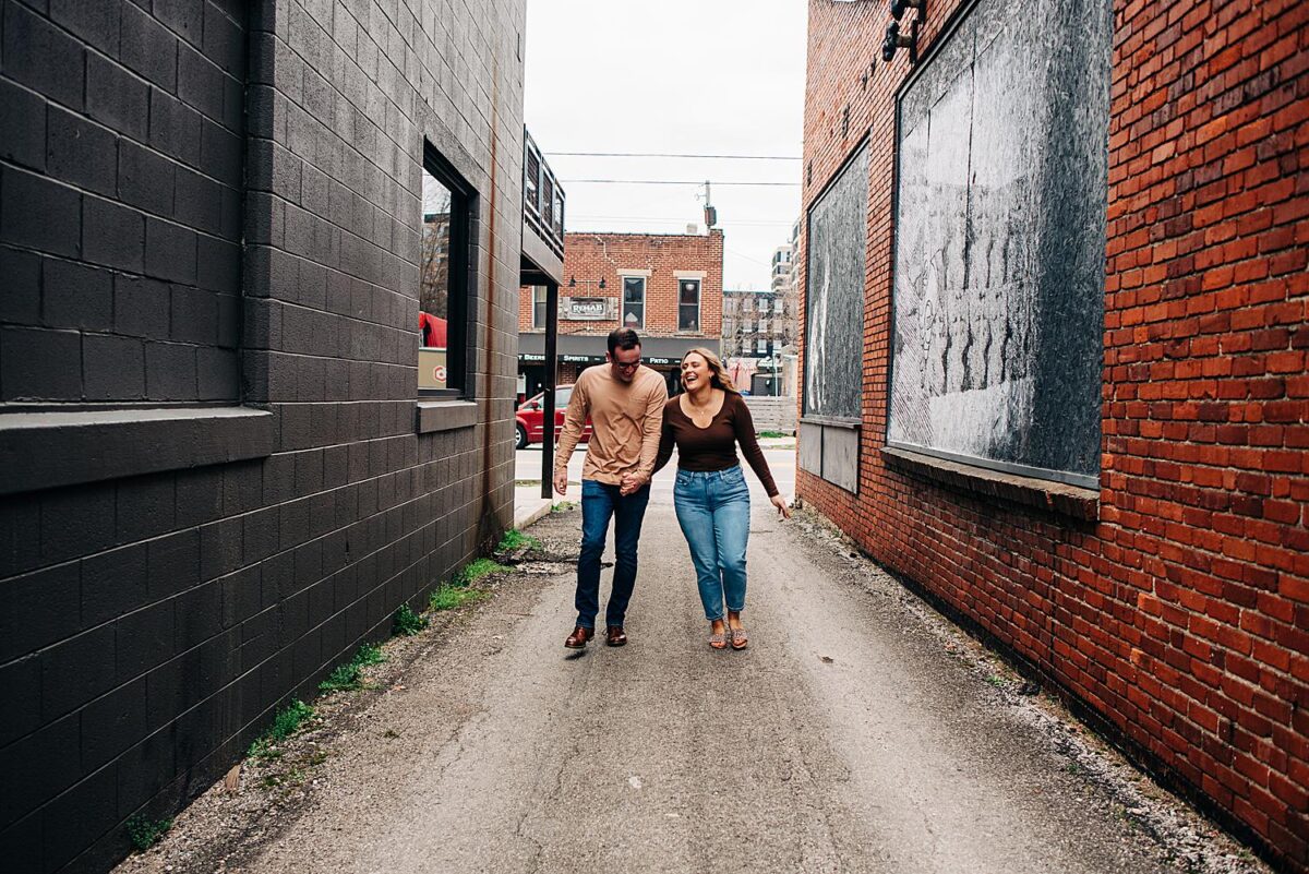 Playful engagement photos at a local Brewery