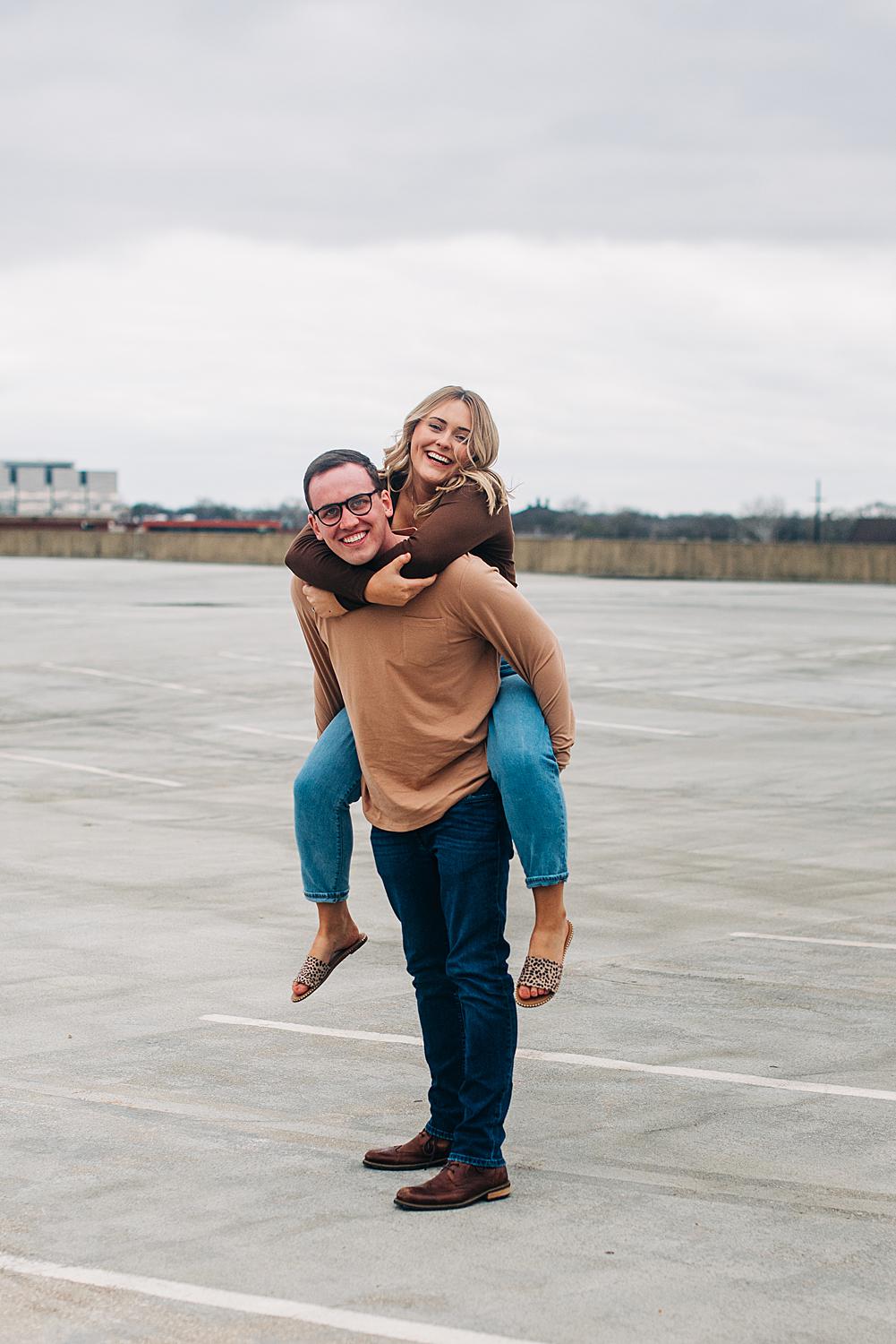 Playful rooftop engagement photos in downtown Columbus