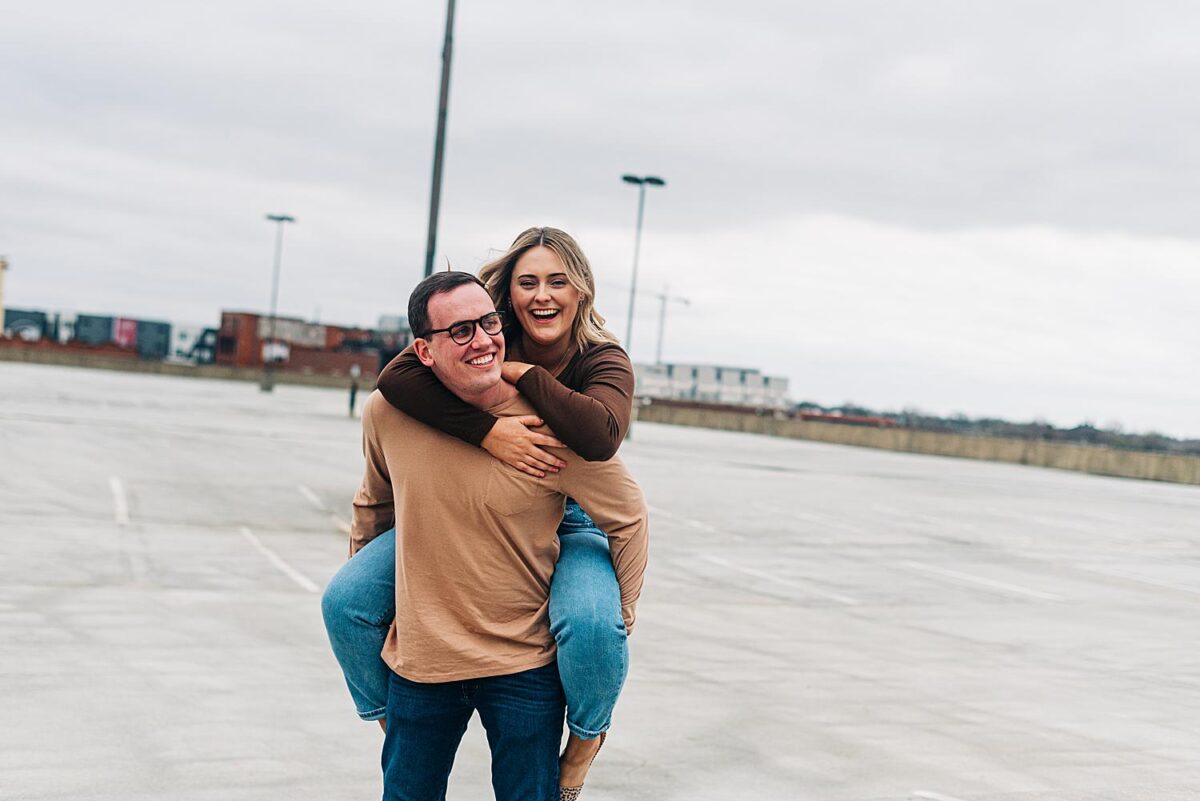 Playful rooftop engagement photos in downtown Columbus