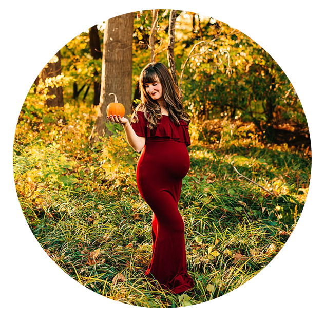 Columbus Ohio Maternity Photographer captures expecting mother while holding a small pumpkin close to her baby bump