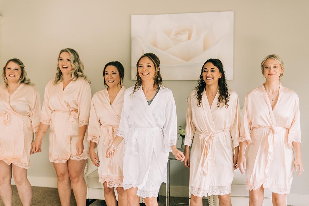 Bride and bridesmaids film an Instagram reel before Bride puts her dress on