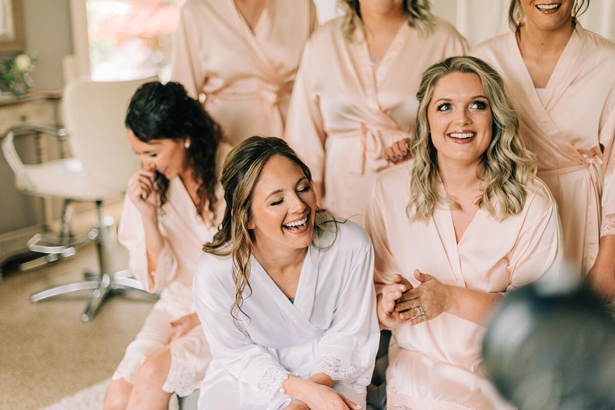 Bride and bridesmaids giggle
