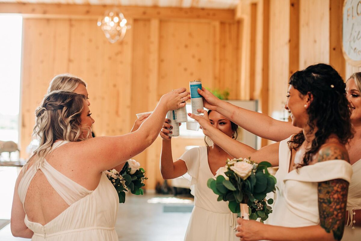 Bridesmaids toast at Flora and Field wedding venue