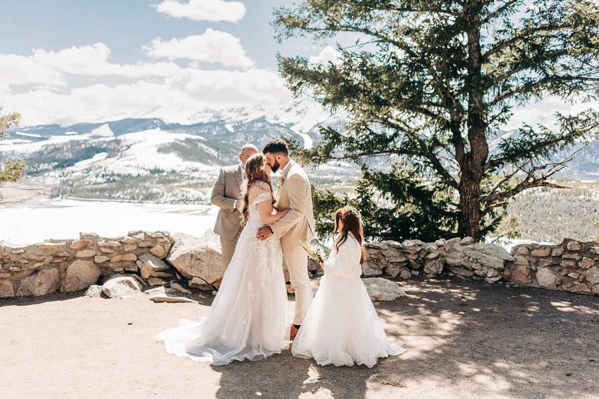 Bride and groom share their first kiss during their Elopement at Sapphire Point Overlook