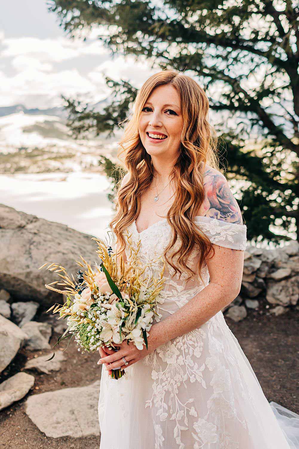 Bride smiles at camera after her Sapphire Point Overlook Elopement