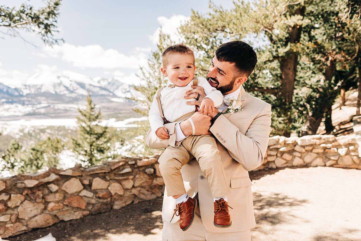 Groom plays with his son 